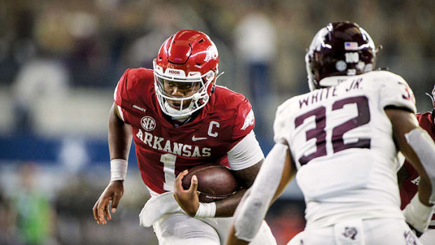 Arkansas Razorbacks quarterback KJ Jefferson (1) runs for a first down against the Texas A&M Aggies during the second half at AT&T Stadium.